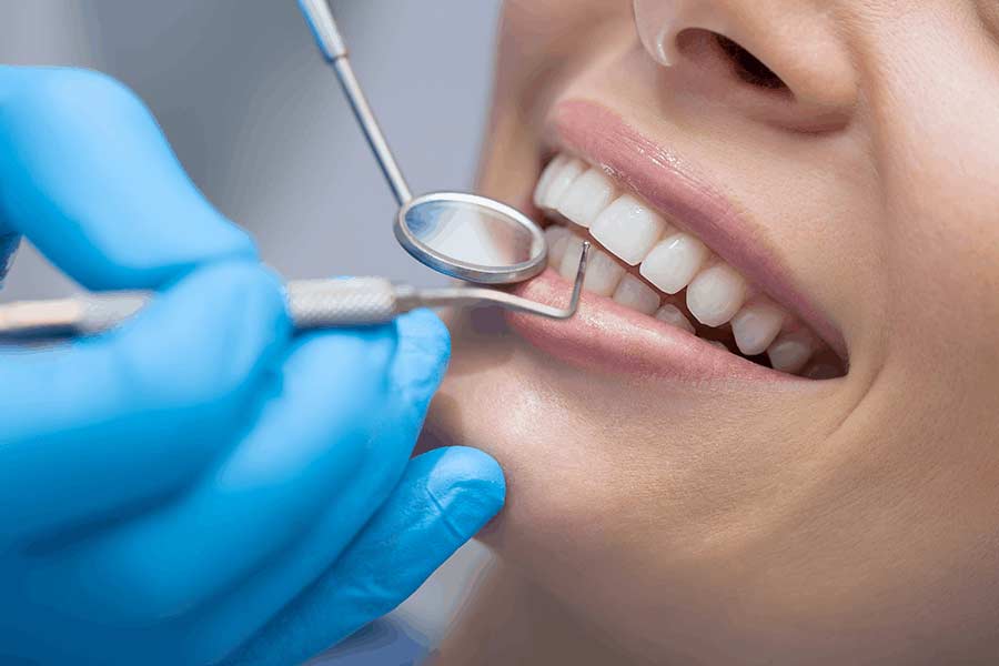 Patient receiving a routine cleaning from a dentist