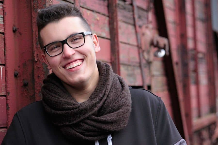 Young person smiling to show off whitened teeth