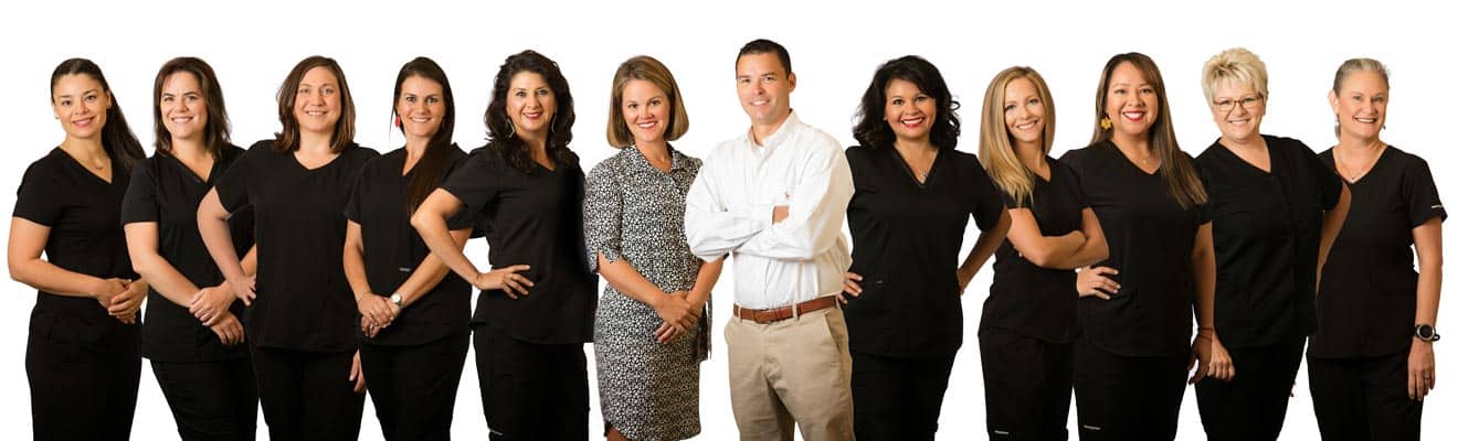 Group photo of the Carothers Family Dental staff and doctors